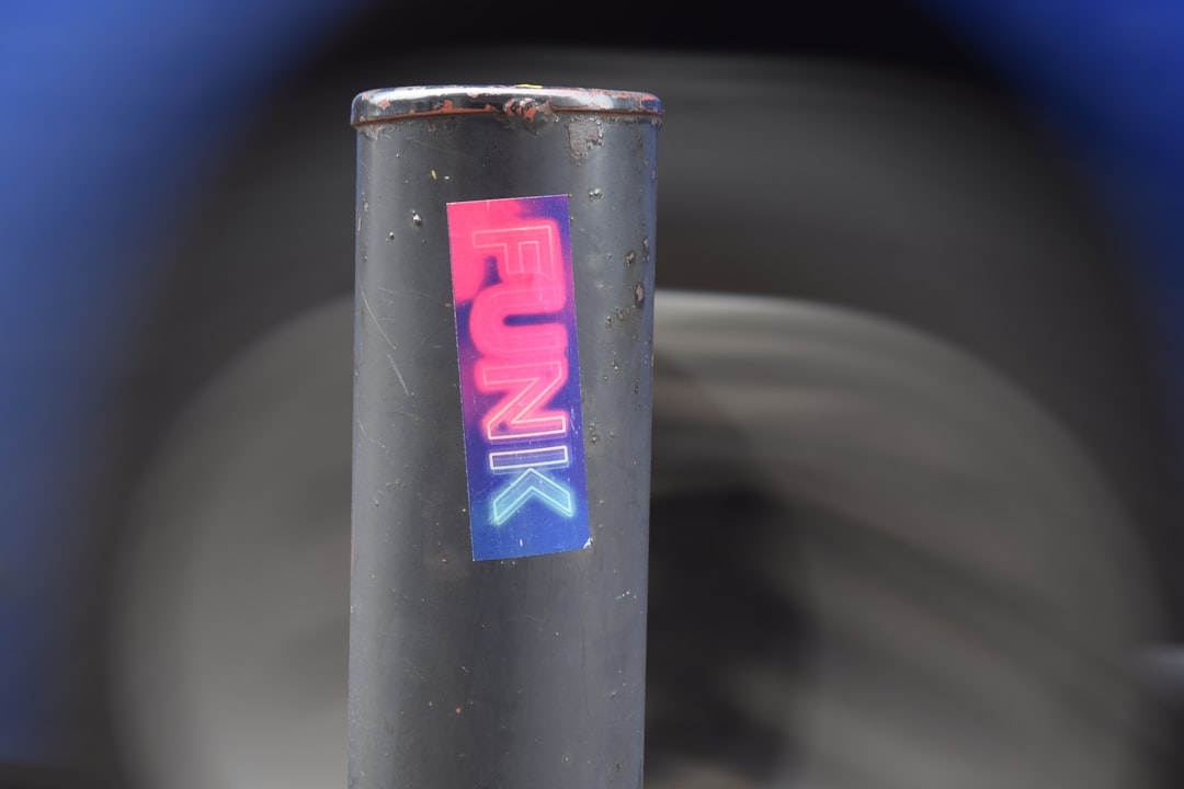 a-metal-pole-with-a-colorful-funk-sticker-jnmkkp0lbmw