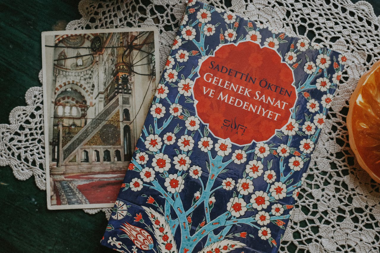 Beautiful Turkish book and mosque image on a lace tablecloth, evoking tradition.